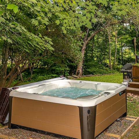 Sink into the large hot tub with friends as the sun goes down
