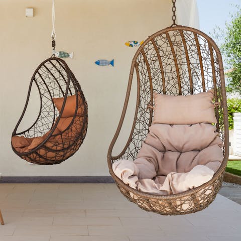 Grab a book and unwind in one of the swinging egg chairs