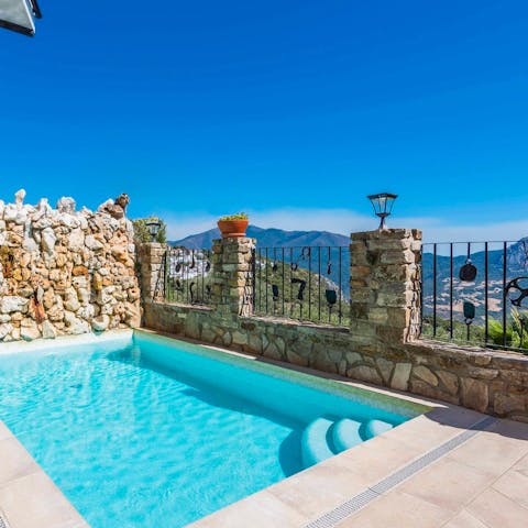 Float in the pool against stunning mountain views