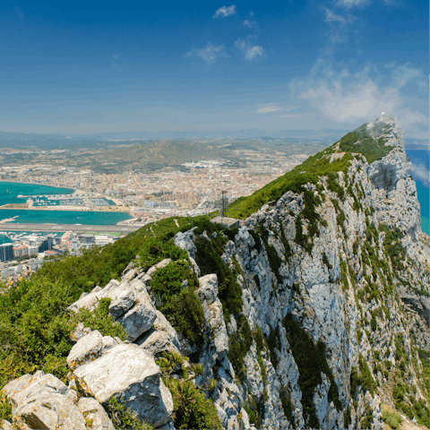 Drive into Gibraltar and visit the iconic rock formation