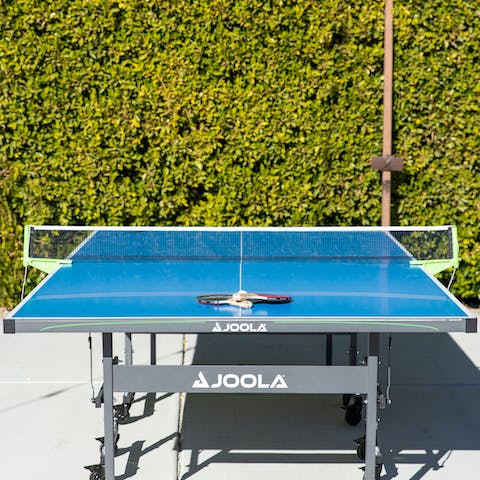 Enjoy a game of ping pong outdoors, or shuffle board indoors