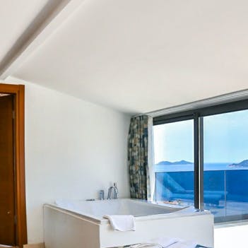 Watch the sunset from the main bedroom's private jacuzzi