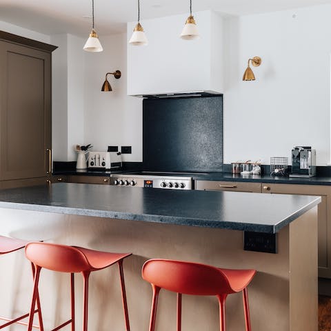 Perch at the sleek, black breakfast bar for your morning coffee
