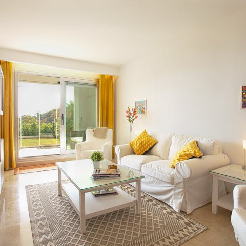 Kick back and relax in the bright living area with a glass of Spanish wine
