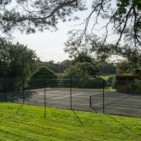 Work up an appetite with a few games of tennis on the private court