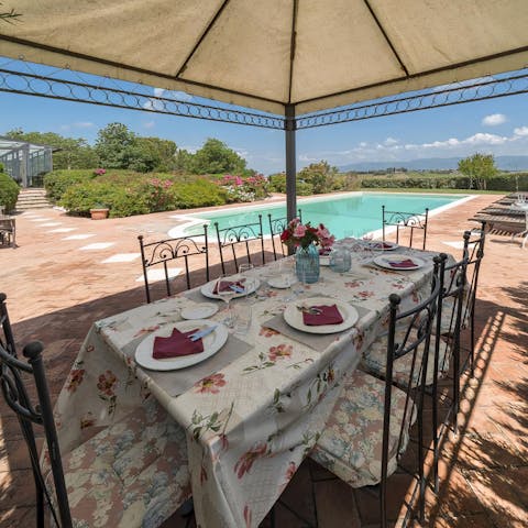 Dine informally at the poolside pergola