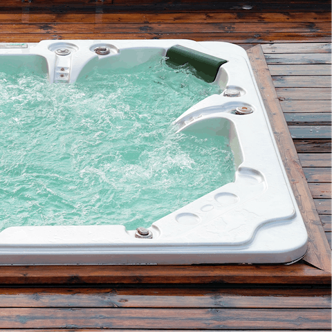 Sit outside in the four-person hot tub and enjoy the rural tranquillity