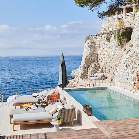 Bask in a gentle Mediterranean Sea breeze by the private lap pool
