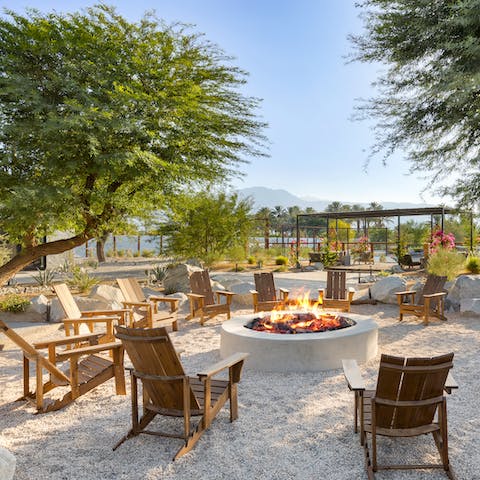 Gather around the firepit beneath the mesquite trees