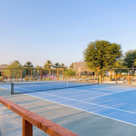 Crack out the rackets and get a game going on the full-size tennis court