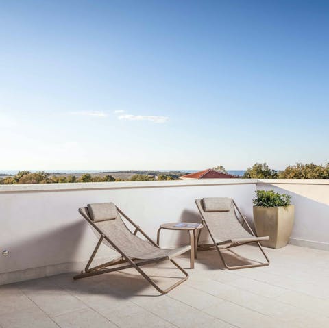 Head up to the balcony to watch the sunset over the countryside