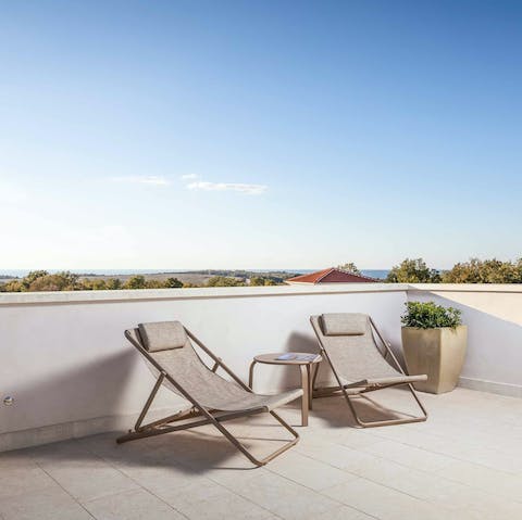 Head up to the balcony to watch the sunset over the countryside