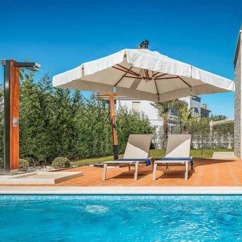 Spend lazy afternoons in the pool when you're not at the beach