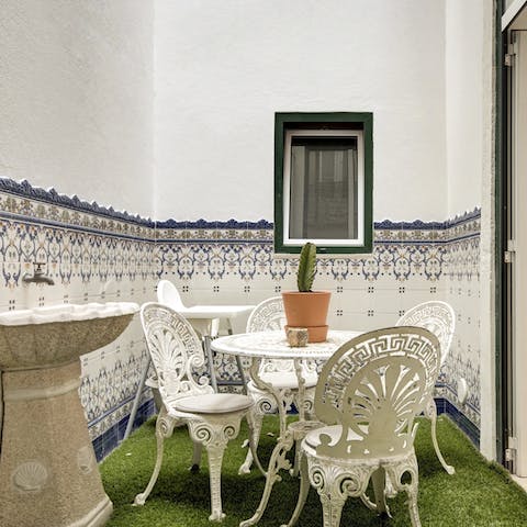 Enjoy a morning coffee in the characterfully tiled courtyard