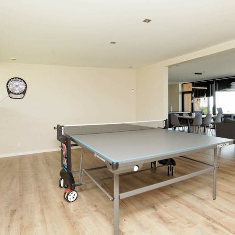 Keep kids entertained in the games room with darts and ping pong