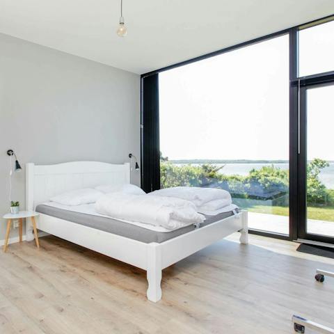 Wake up to waterfront views from walls of glass in the bedrooms