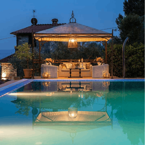 Sip wine on the poolside veranda as the sun goes down