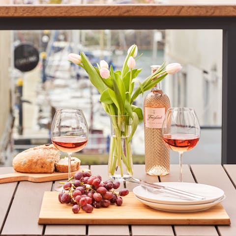 Enjoy a chilled glass of wine on your sunny private balcony