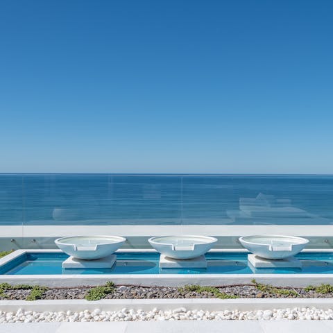 Relax on the roof terrace with its hot tub and water features