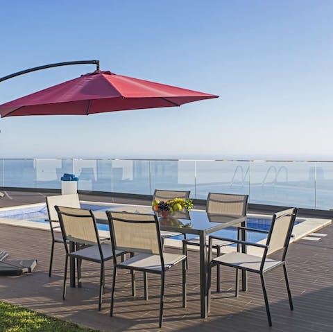 Enjoy drinks with a view, perched on a hilltop overlooking the sea