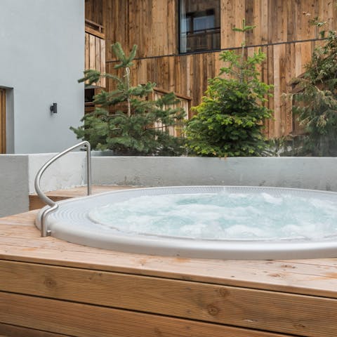 Soothe your aching muscles in the outdoor jacuzzi