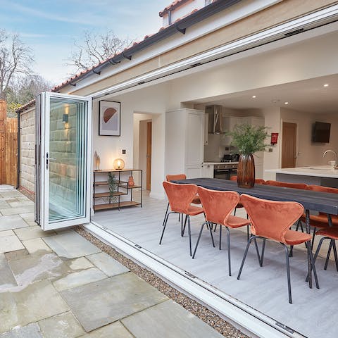 Throw open the bi-fold doors and enjoy every meal in the sunshine