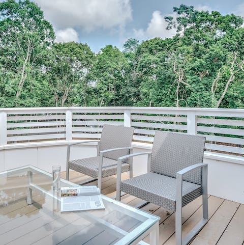 Enjoy lush treetop views from the private sun deck