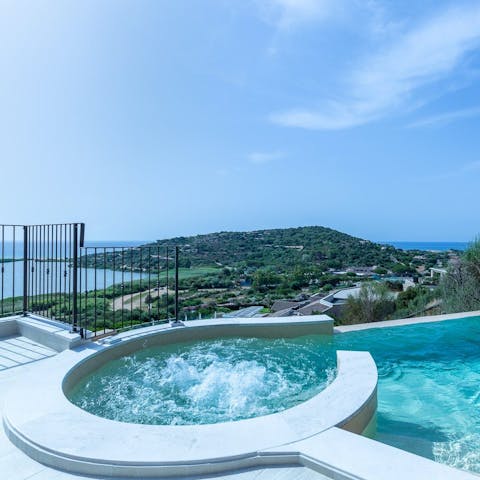 Soak in the pool's whirlpool corner overlooking the sea