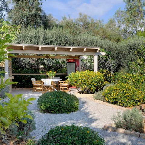 Enjoy a tranquil breakfast out among the plant-filled garden