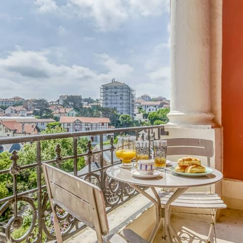 Start your day with coffee and pastries on the sunny balcony