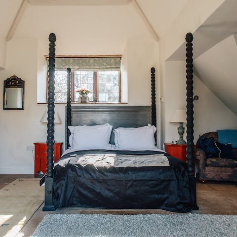Sleep in this dramatic four-poster bed
