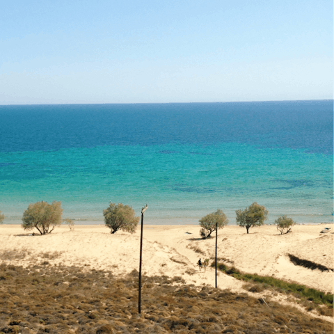 Spend a day on the sand at Agrari Beach – it's just a two-minute drive away