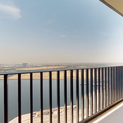 Take in the Dubai Creek vistas from the private balcony