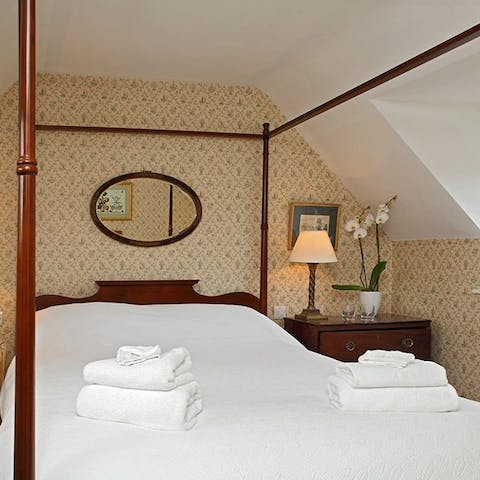 Fall back into your elegant four-poster bed and enjoy a blissful sleep