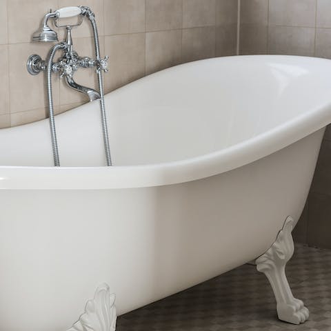 Unwind with a soak in the roll-top, clawfoot bathtub 