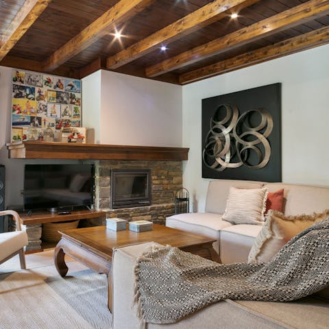 Spend cosy evenings in the living room gathered around the fireplace
