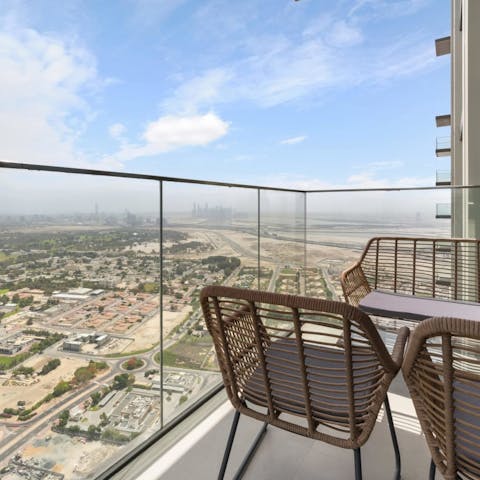 Sit at the lounge seating on your balcony, towering above Za'Abeel Park