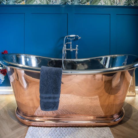 Have a long soak in the gorgeous copper bath tub 