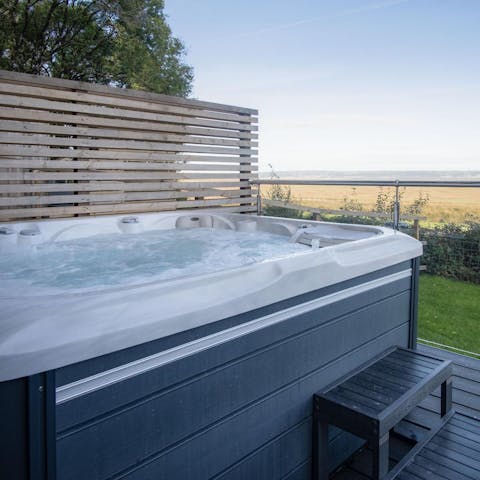 Enjoy a glass of fizz in the hot tub