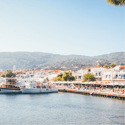 Explore Skiathos town and harbour, a fourteen-minute walk away