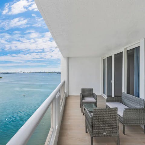 Sit out on the apartment's balcony and enjoy the uninterrupted vista of sea and skyscrapers