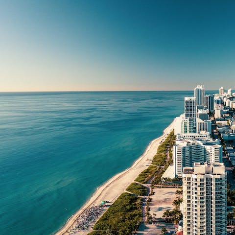Stay in a luxurious building a twenty-minute cab ride from Miami Beach