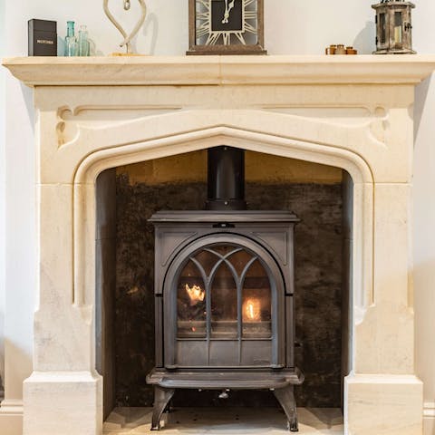 Get cosy beside the wood-burning stove on chilly evenings