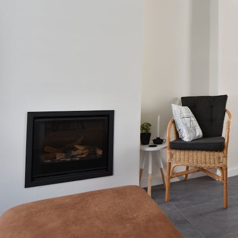 Get the fire going in the living room to keep things cosy-warm