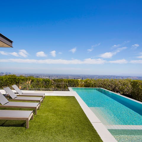 Enjoy incredible views while relaxing by the pool