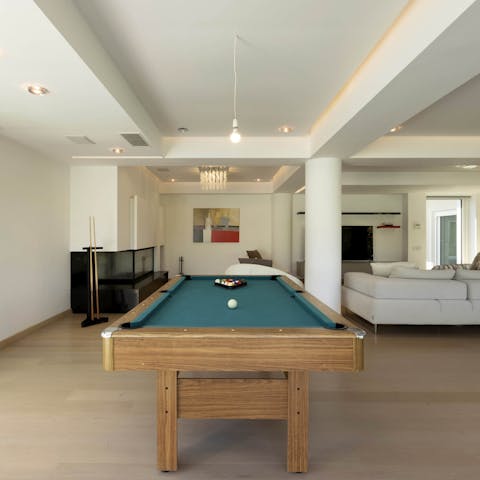 Get competitive with a round of pool in the games room