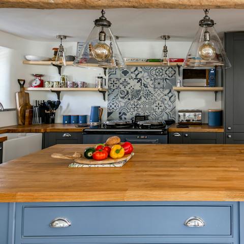 Cook up a storm in the well stocked, open plan kitchen
