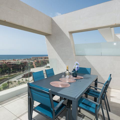 Enjoy meals alfresco on the outdoor dining table, sipping on wine and overlooking the Mediterranean sea