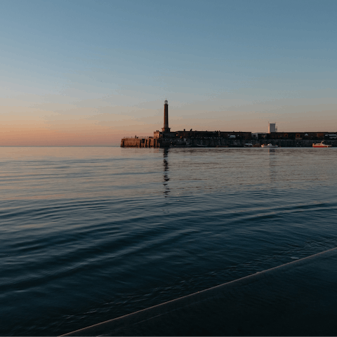 Head down to the steps for sundowners looking out over the harbour arm