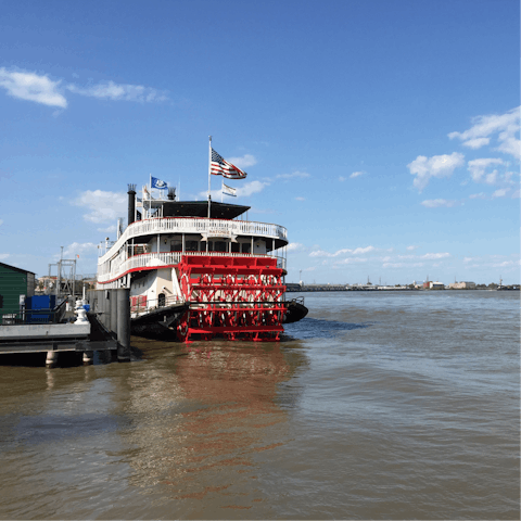 Cruise along the Mississippi River aboard the Steamboat Natchez Riverboat, fifteen minutes away on foot